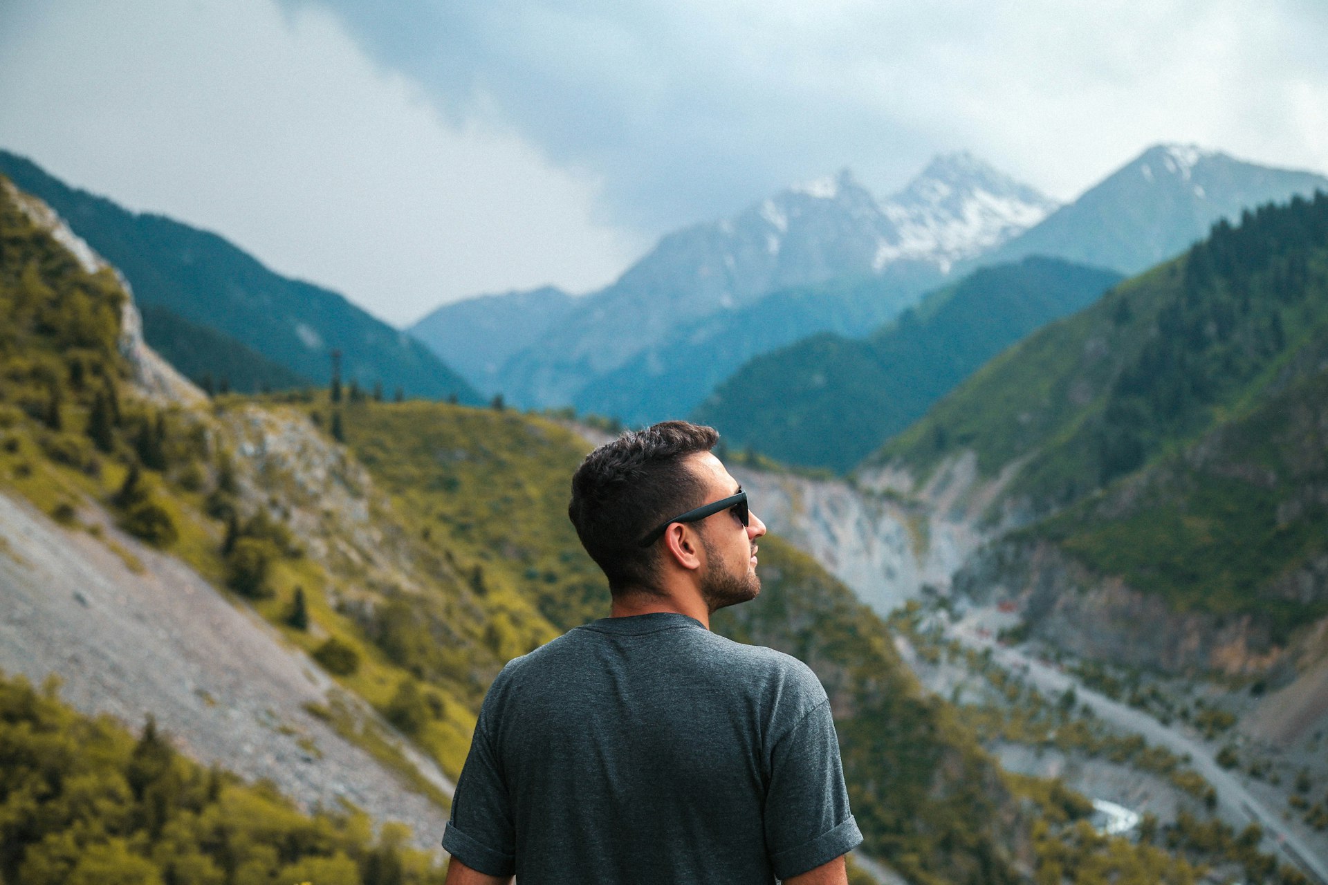 man standing in front of mountain